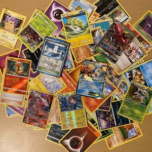 130 Assorted Pokémon Cards with box